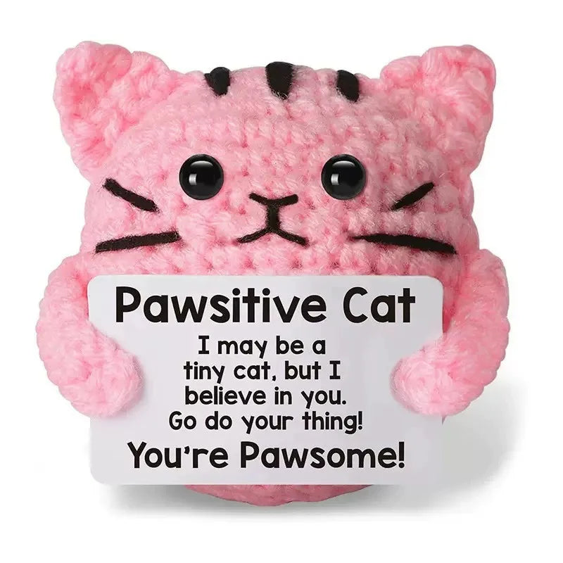 Pink crocheted cat doll with black stripes and an inspirational card that says You're Pawsome