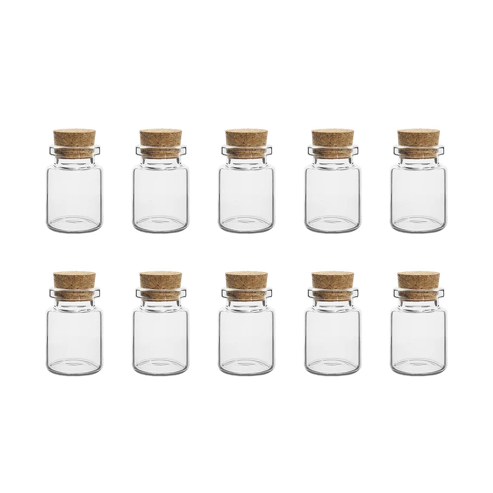 A row of nine clear glass vials with natural cork stoppers arranged in a grid.