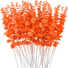 Bright orange artificial eucalyptus leaves arranged on thin stems for home and event decor