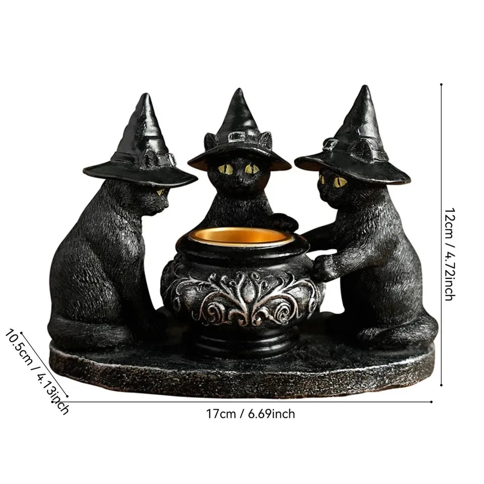A black Halloween magic cat candle holder featuring three sculpted cats in a row.