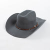 A gray wool cowboy hat with a studded leather band around the crown.