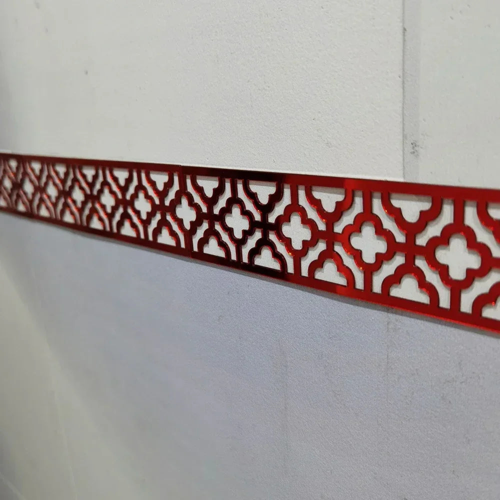 Decorative red acrylic mirror wall stickers featuring an intricate geometric pattern for edge and corner trim.