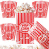 Red and white striped popcorn buckets with popcorn inside