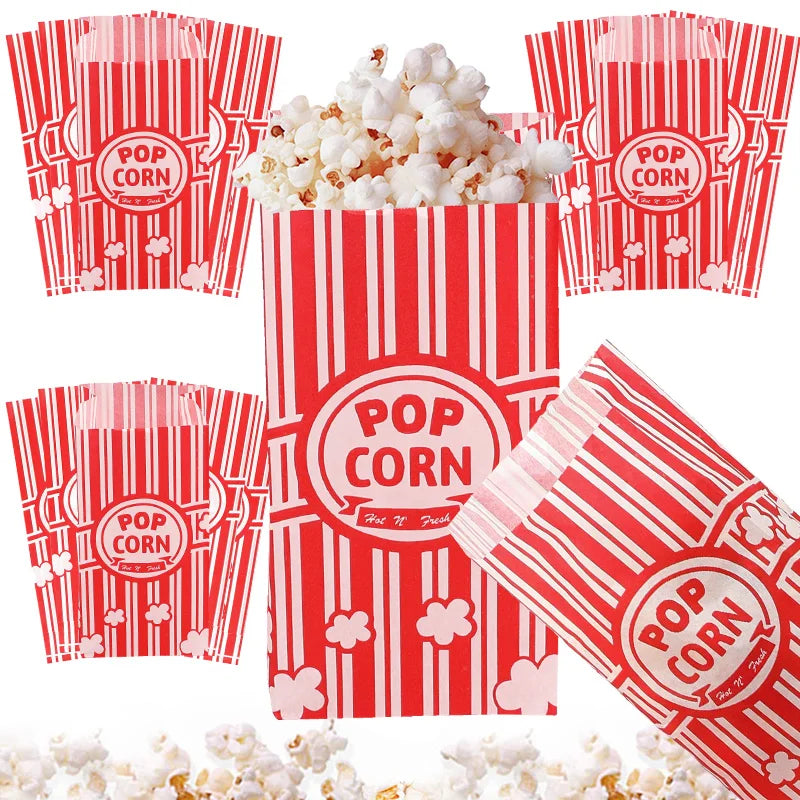 Red and white striped popcorn buckets with popcorn inside