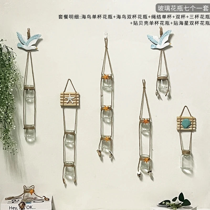 A collection of decorative glass terrariums featuring various plant arrangements and designs.