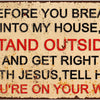 A vintage metal sign with red text warning people to stand outside and get right with Jesus before breaking into a house.