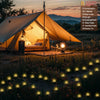 A tent setup featuring solar powered bubble ball garden lights with eight lighting modes illuminating a grassy field at sunse