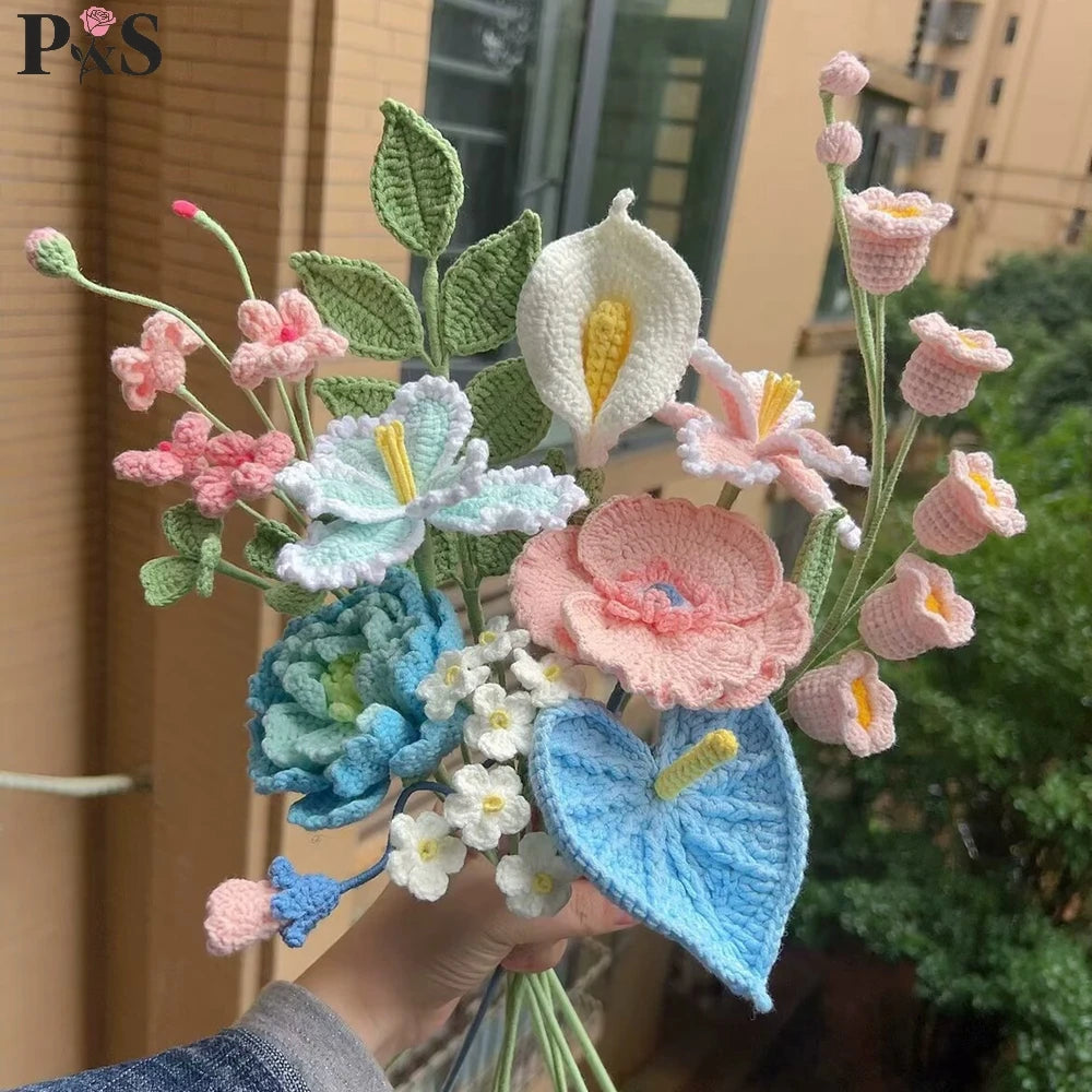 A handmade crochet flower bouquet featuring various shades of pink, blue, and white flowers.