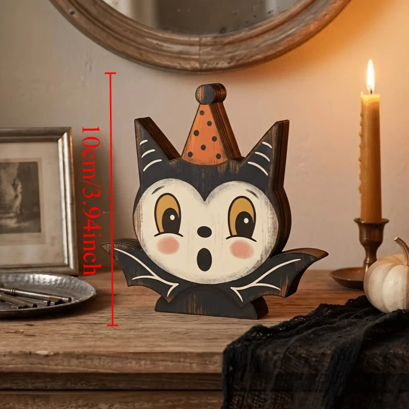 A wooden cat face Halloween decor set with orange accents displayed on a rustic wooden surface.