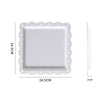 A white decorative food tray with a scalloped edge and a square serving dish.