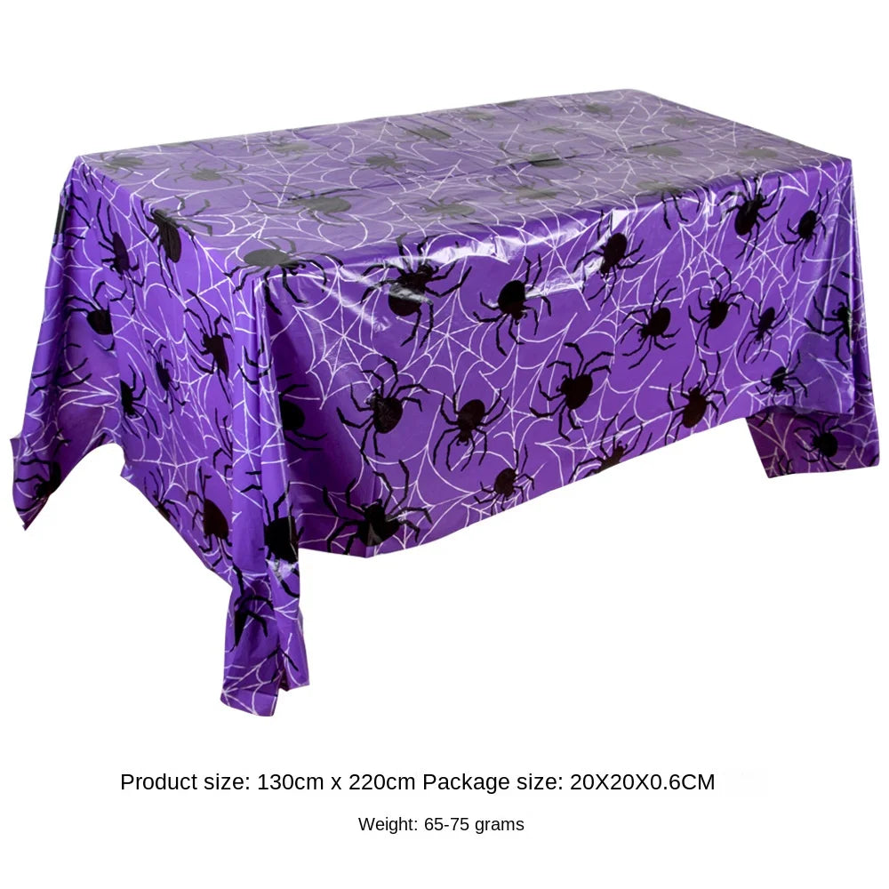 Purple Halloween tablecloth featuring a pattern of spiders, webs, and bats.