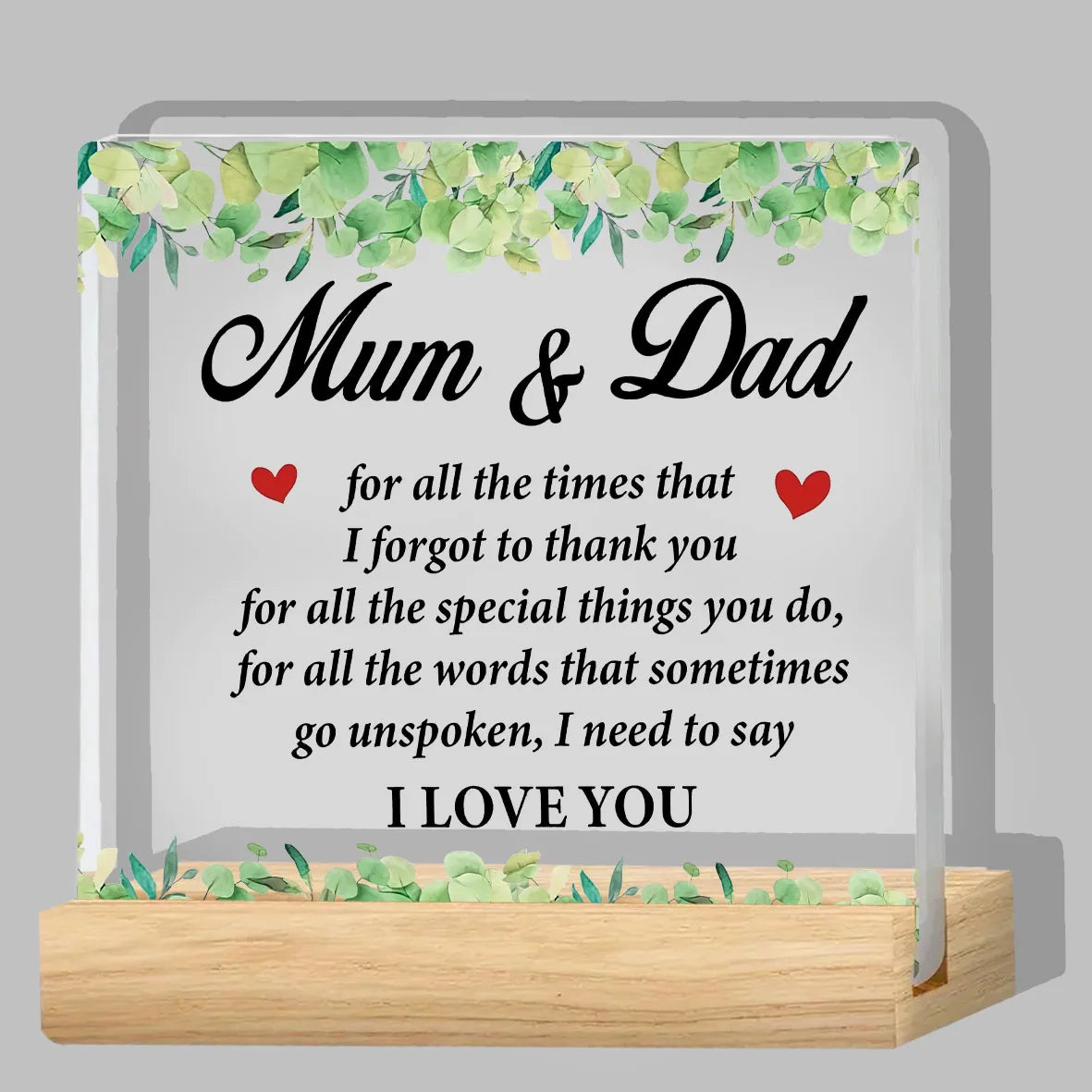 A clear acrylic thank you plaque with a green leafy border and the message Mum & Dad for all the times that I forgot to thank
