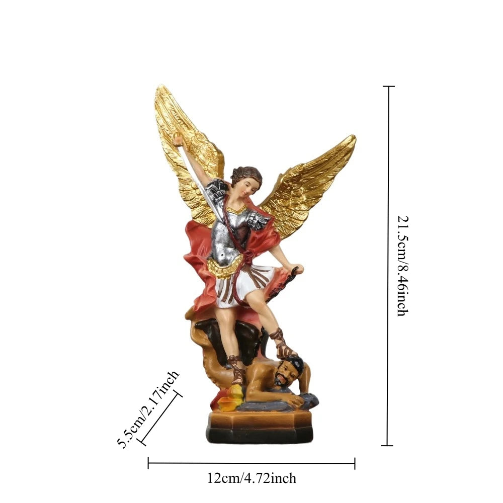 A resin statue of Saint Michael the Archangel with golden wings and a figure lying beneath him.