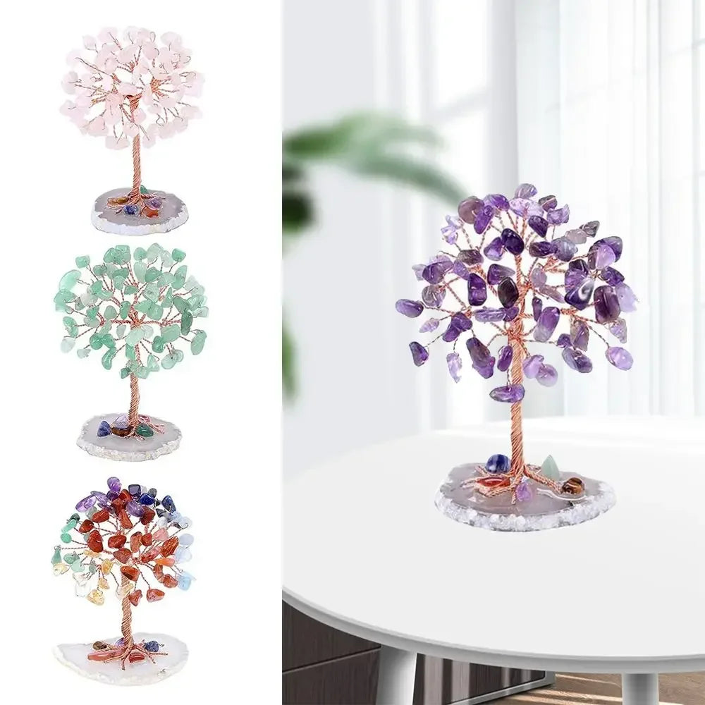 A display of four crystal money tree decor plants in various shades of pink, green, and purple.