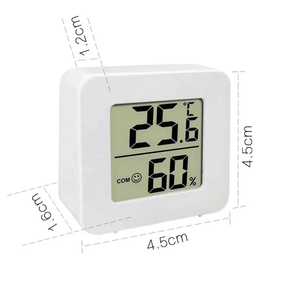 A white LED digital thermometer and hygrometer displaying 25.6 degrees Celsius and 60 percent humidity.