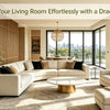 A living room decorated with a large potted Dracaena tree and modern furniture overlooking a city view.
