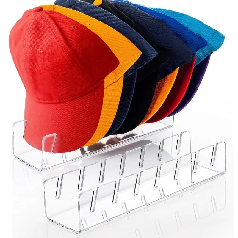 Acrylic storage rack displaying a row of colorful fabric caps.