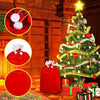 Festive red velvet Santa Claus gift bags displayed next to a decorated Christmas tree.