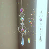 A silver crystal moon and sun wind chime decor set featuring various colored crystals and charms hanging from a chain.