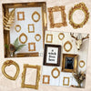 A collection of vintage gold mini picture frames, including various sizes and ornate frames, displayed on a light background.