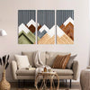 A set of three vertical wall art prints featuring mountains in muted earth tones and white against a gray background.