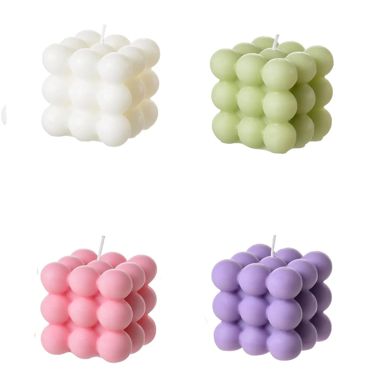 A set of two soy wax candles shaped like cubes in white and pink colors.