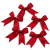 A set of three red satin ribbon bows displayed against a white background.