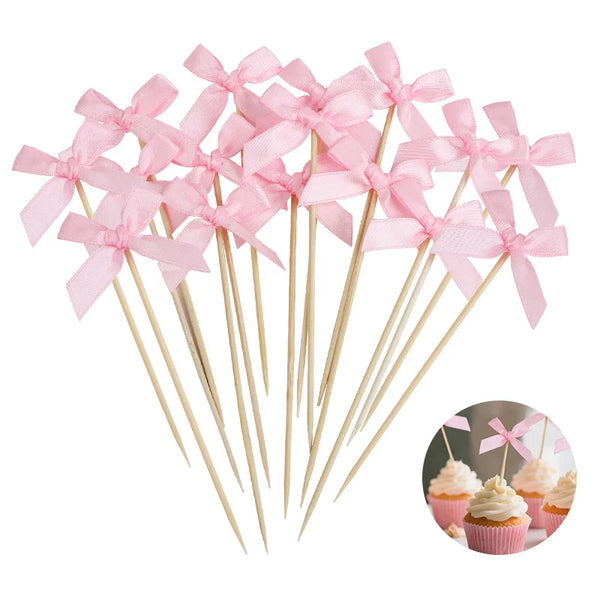 Pink bow cupcake toppers on wooden sticks for parties and celebrations