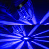 A hand holds a clear LED side marker light, illuminating bright blue beams against a dark background.