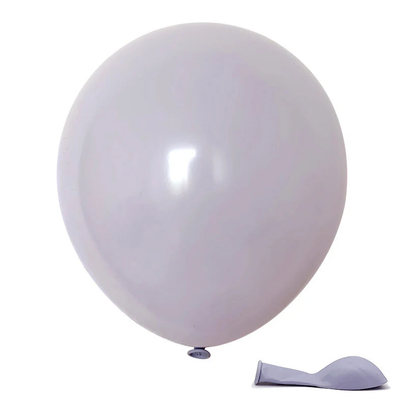 A single white balloon is shown next to a small, light purple spatula.