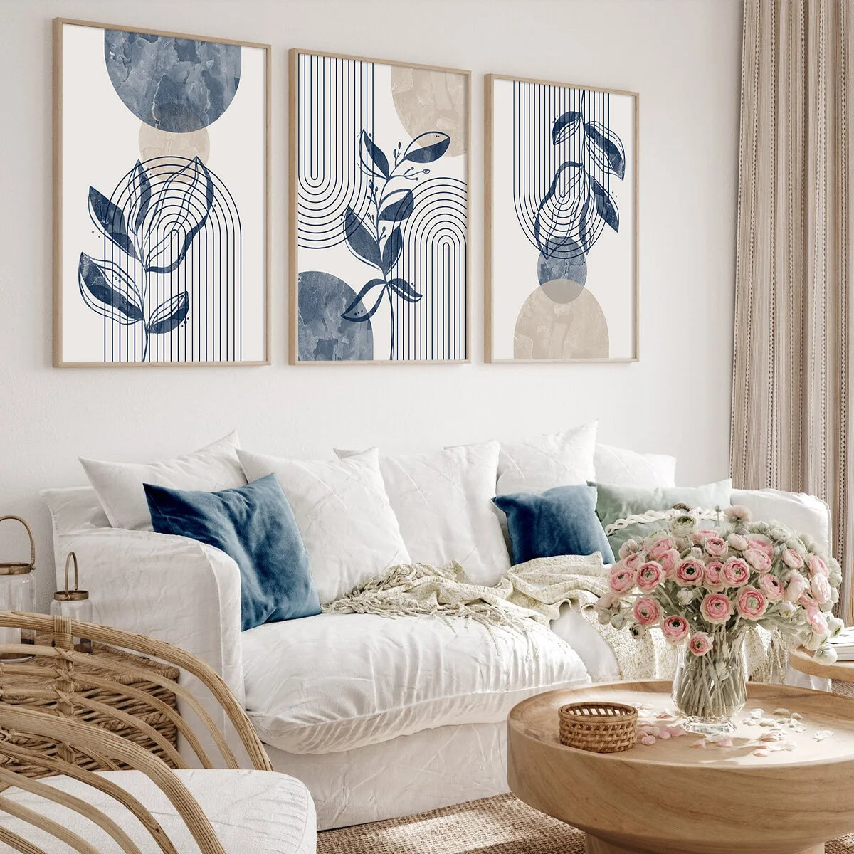 Three abstract geometric wall art prints featuring blue and beige tones displayed on a white wall.