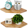 A set of two wall-mounted corner shelves featuring a vintage alarm clock and an owl decoration on natural wood display boards