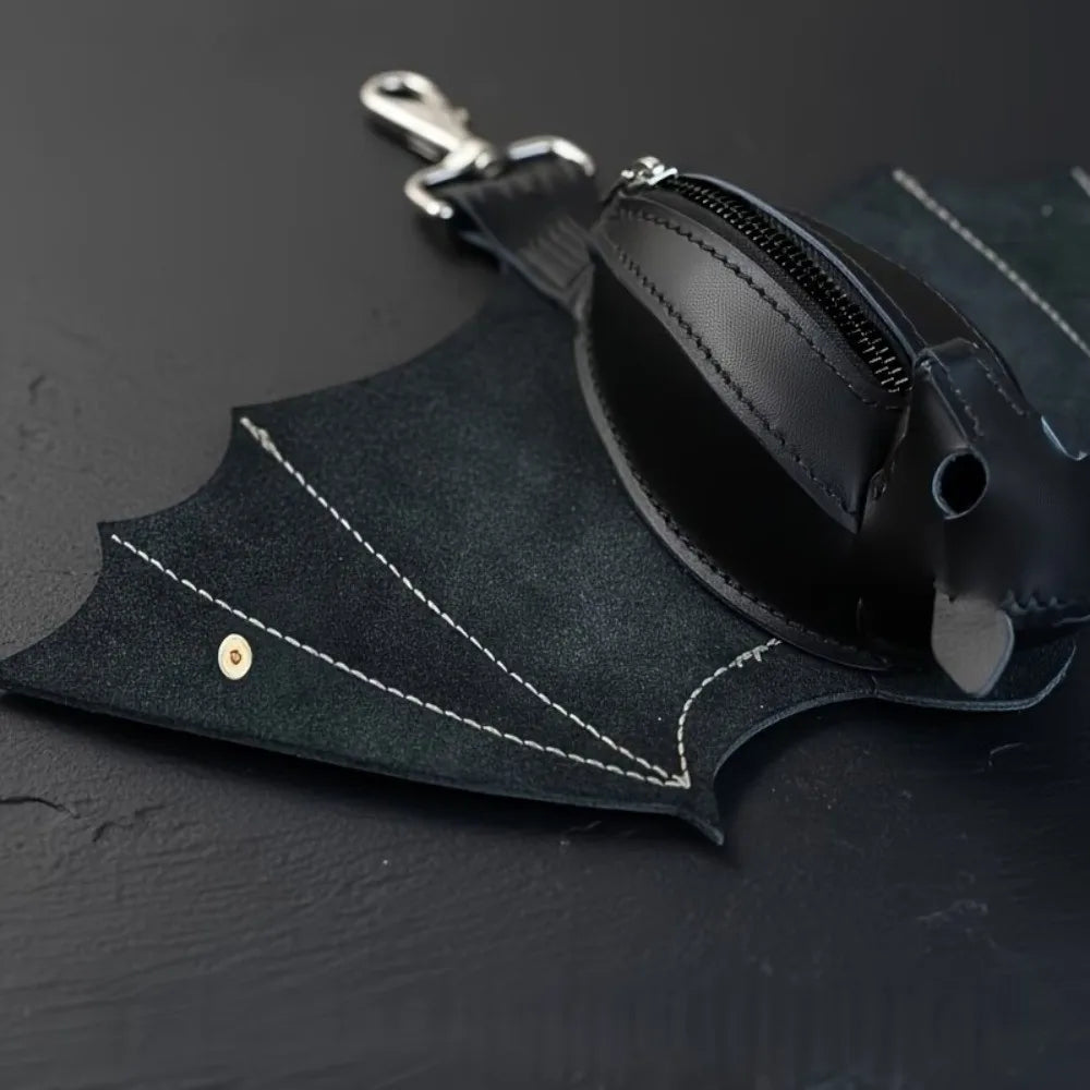 Black leather bat-shaped wallet and keychain with a zipper coin purse