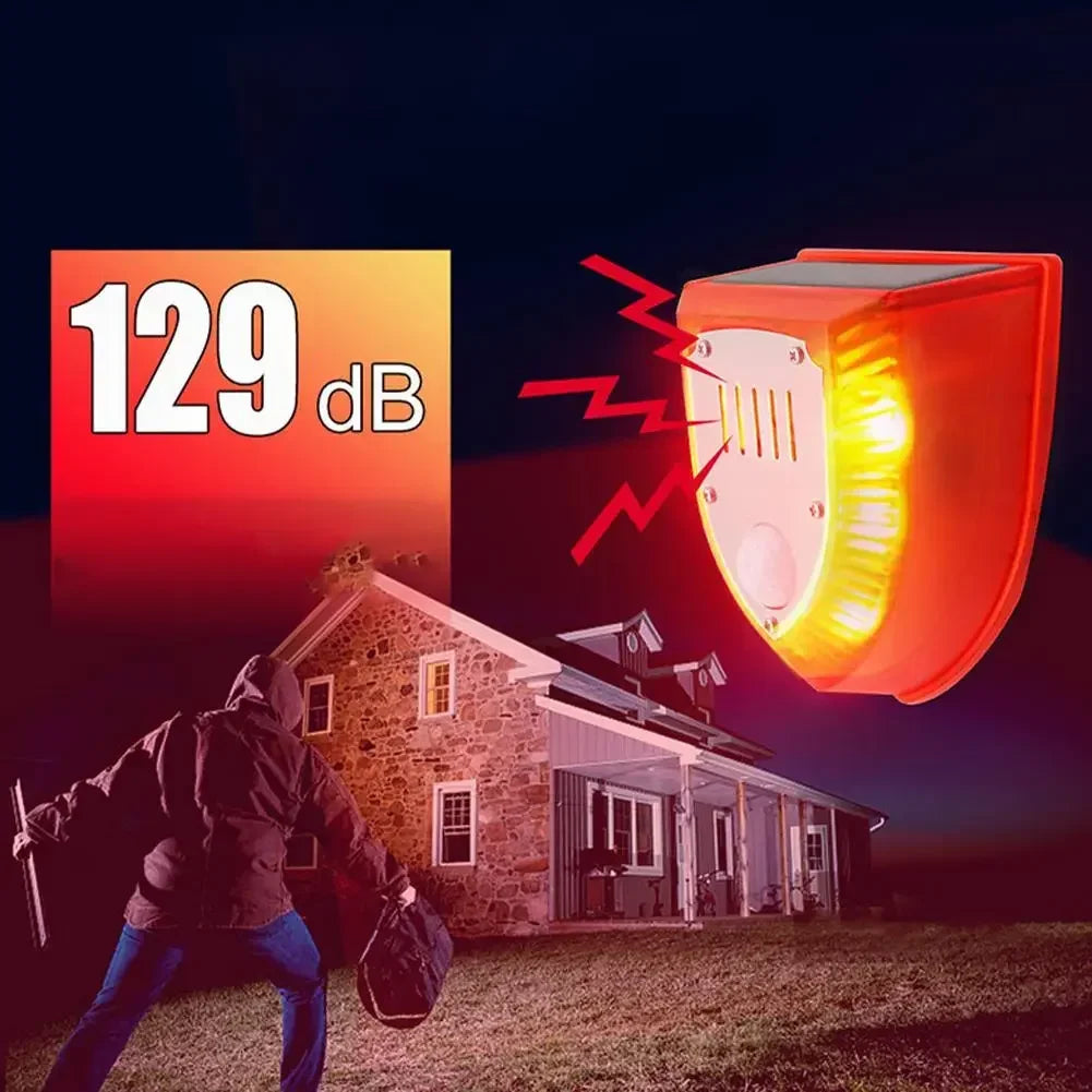 A solar-powered motion sensor alarm device is shown near a stone house, with sound waves indicating its operation.