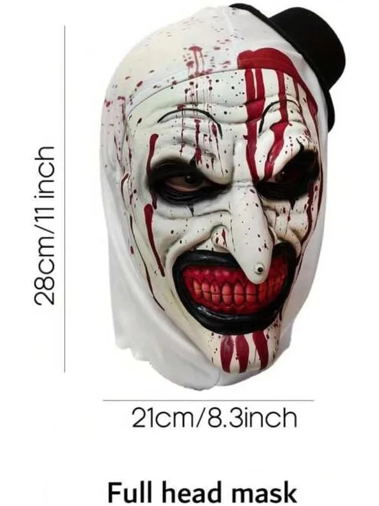 A full head mask of a horror clown with white and red paint splatters on a white face.
