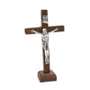 Handcrafted wooden crucifix with a figure of Christ on a stand