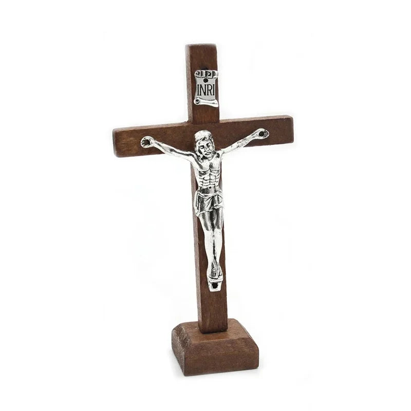 Handcrafted wooden crucifix with a figure of Christ on a stand