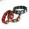 A bracelet made of natural wood beads featuring charms of the Virgin Mary and Jesus.
