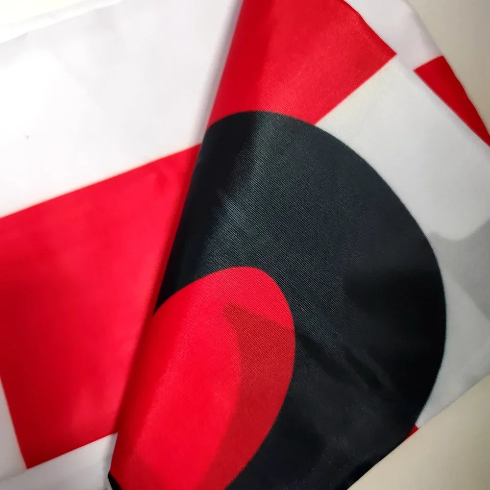 A banner featuring a design with red, white, and black geometric shapes.