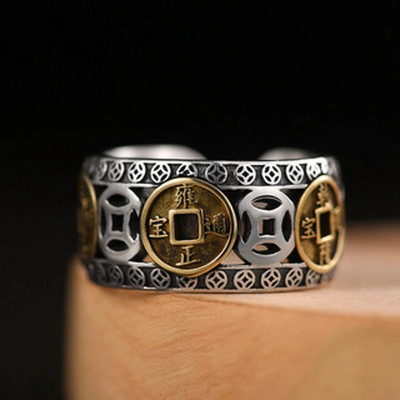 Silver and gold pixiu ring featuring detailed coin designs on the band
