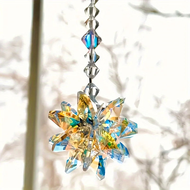A sparkling crystal star suncatcher ornament hangs, featuring blue and yellow facets.