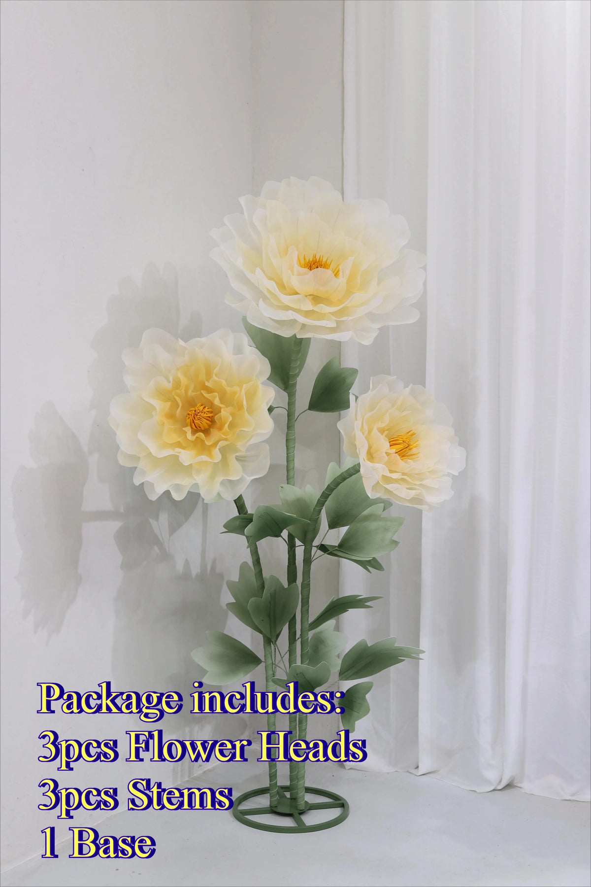 Artificial silk flower arrangement including three flower heads, stems, and a base.