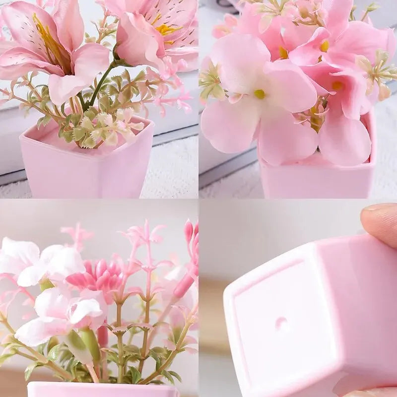 Pinke künstliche Blumen in kleinen Töpfen als Home-Dekoration