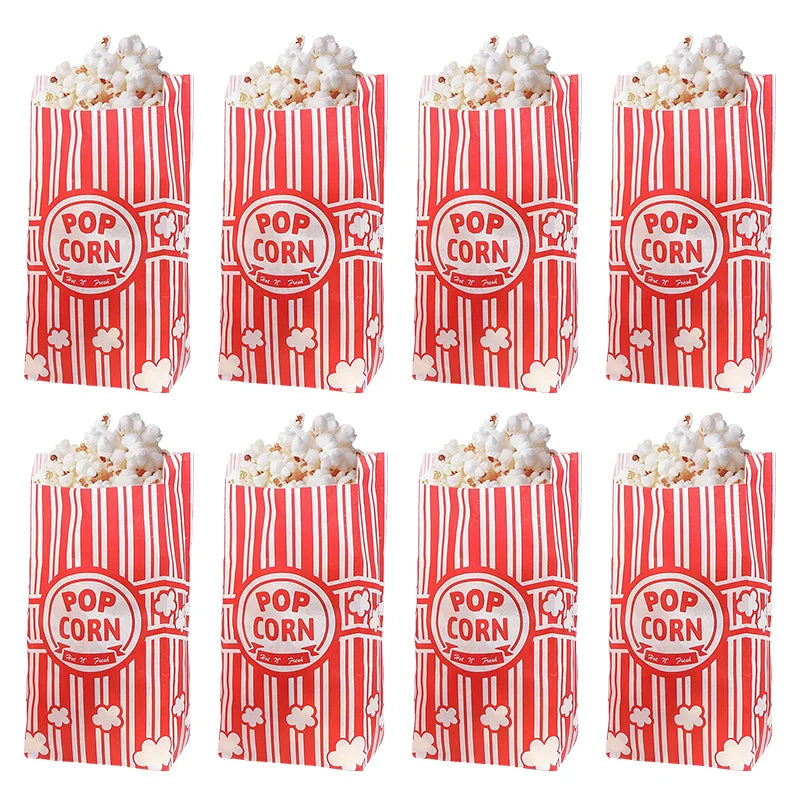 A set of red and white striped popcorn buckets filled with fluffy white popcorn.