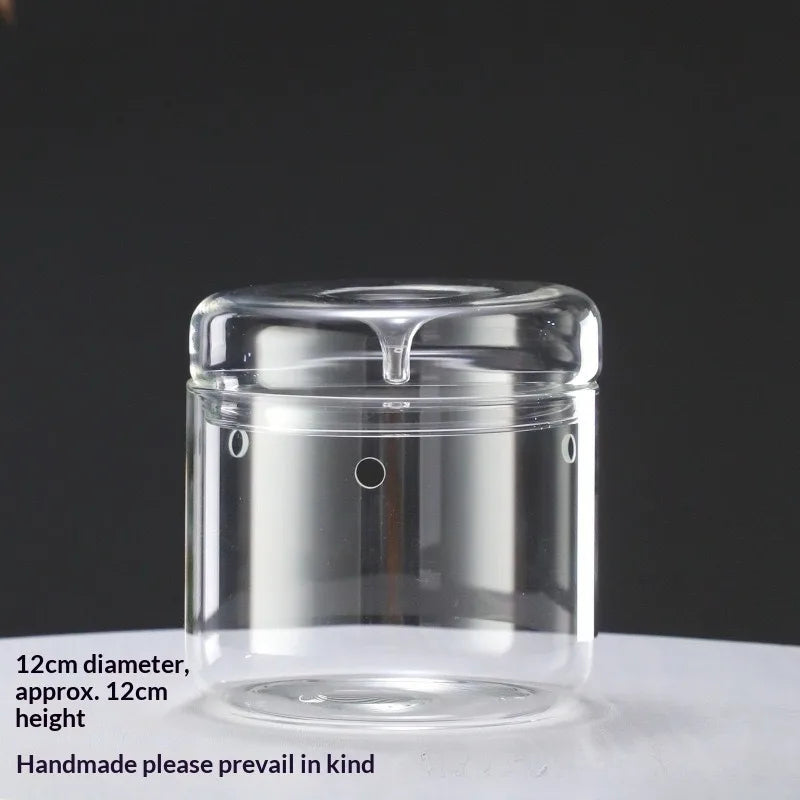 Clear glass decor vase with a lid, 12cm diameter and approx. 12cm height.