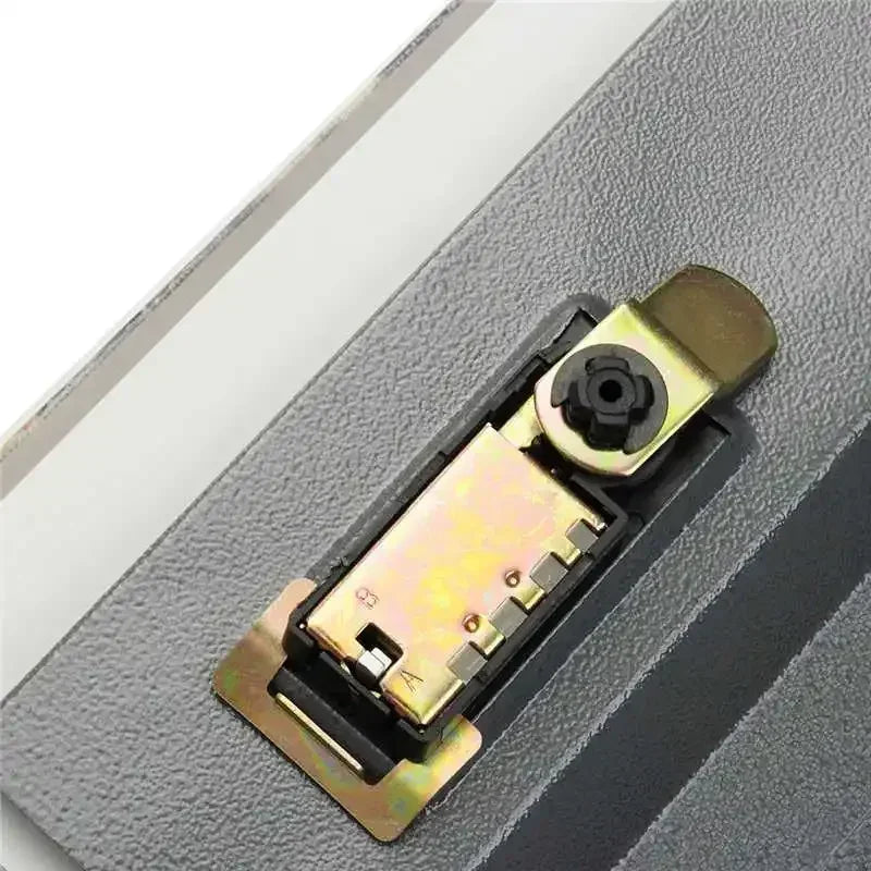 A close-up view of a classic book hidden safe with a combination lock mechanism.
