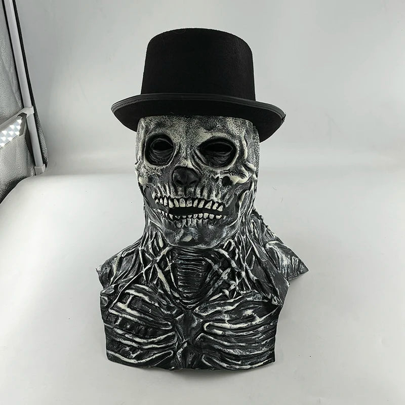 A realistic latex skull mask with a black top hat and skeletal features.