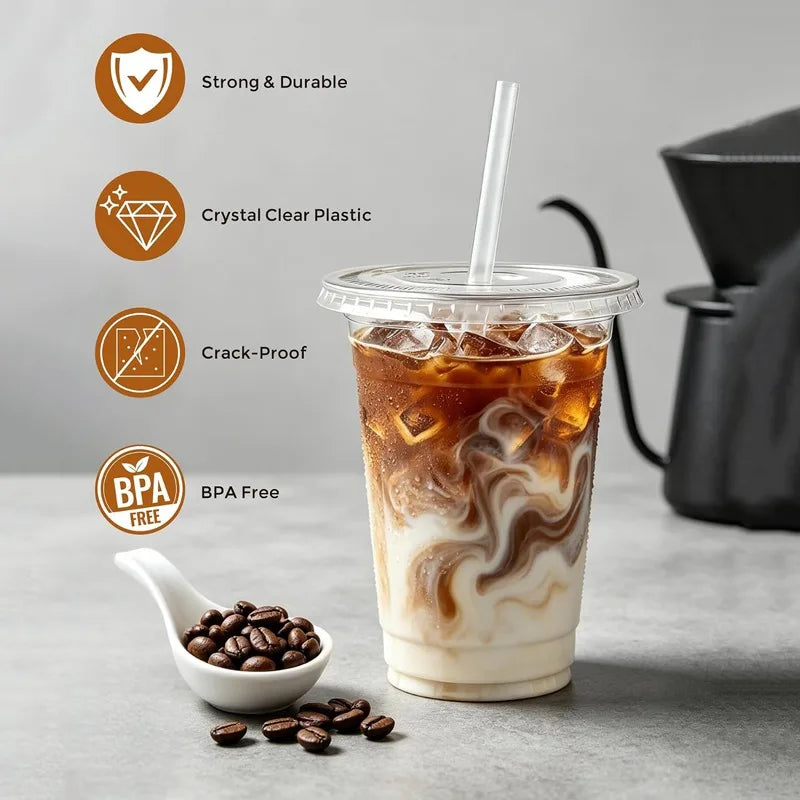 A clear plastic cup filled with iced latte featuring marbled foam art, displayed next to coffee beans and quality icons.
