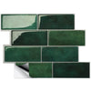 A rectangular mosaic of dark green peel and stick vinyl wall tiles.