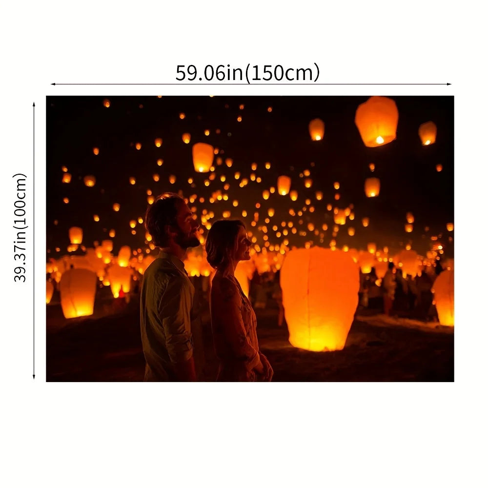 A couple stands in a dark setting surrounded by numerous glowing orange lanterns.